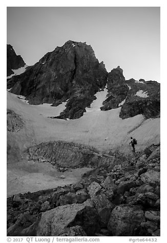 Mountaineer stands below Middle Teton and glacier. Grand Teton National Park (black and white)