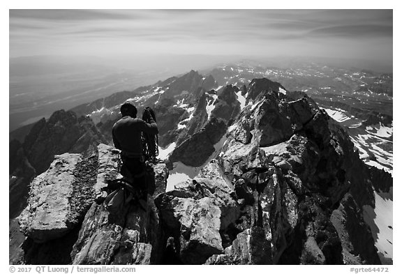 Climber coils rope on Upper Exum Ridge, Grand Teton. Grand Teton National Park (black and white)