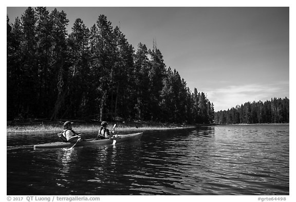Kayakers in forested inlet, Colter Bay. Grand Teton National Park (black and white)