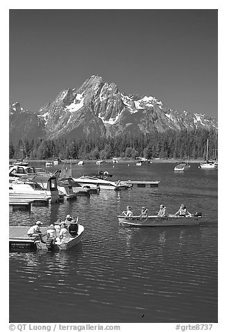 Boaters at Colter Bay marina with Mt Moran in the background, morning. Grand Teton National Park, Wyoming, USA.