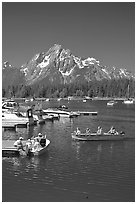 Boaters at Colter Bay marina with Mt Moran in the background, morning. Grand Teton National Park, Wyoming, USA. (black and white)