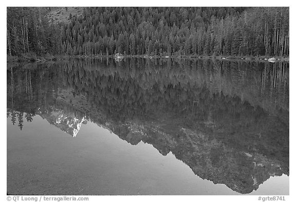 Tetons reflections in Leigh Lake, sunset. Grand Teton National Park, Wyoming, USA.