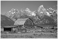 Historic Moulton Barn and Tetons mountain range, morning. Grand Teton National Park ( black and white)