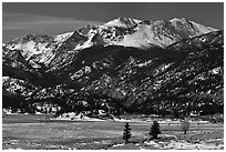 Thawing meadow and snowy peaks, late winter. Rocky Mountain National Park, Colorado, USA. (black and white)