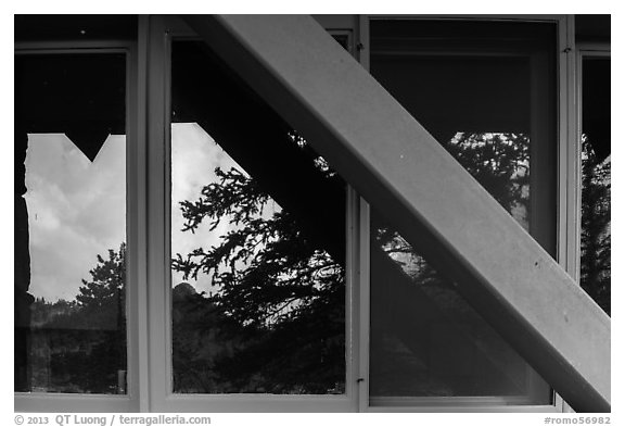 Foothills and trees, Beaver Meadows Visitor Center window reflexion. Rocky Mountain National Park (black and white)