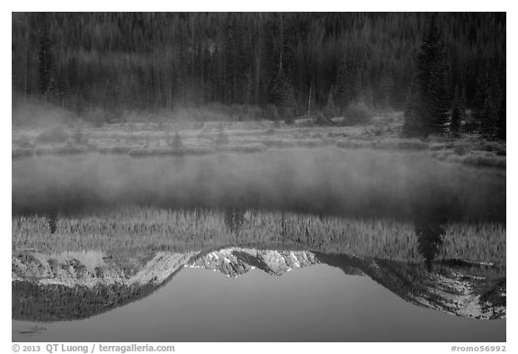 Mist and Never Summer Mountains reflection. Rocky Mountain National Park, Colorado, USA.