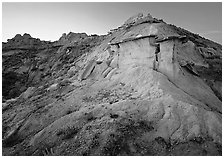 Badlands and caprock formation at sunset, South Unit. Theodore Roosevelt National Park, North Dakota, USA. (black and white)