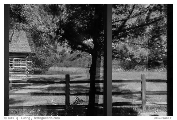 Maltese Cross cabin, Medora Visitor Center window reflexion. Theodore Roosevelt National Park (black and white)