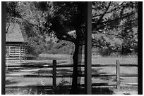 Maltese Cross cabin, Medora Visitor Center window reflexion. Theodore Roosevelt National Park, North Dakota, USA. (black and white)