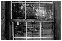 Badlands reflected in Maltese Cross cabin window. Theodore Roosevelt National Park ( black and white)