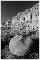 Large cannonball concretions and cliff. Theodore Roosevelt National Park, North Dakota, USA. (black and white)