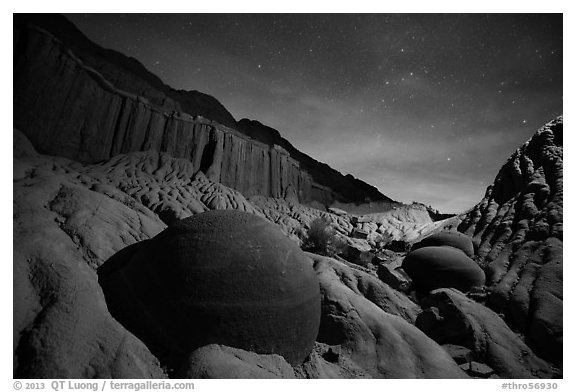 Cannonball and badlands with night starry sky. Theodore Roosevelt National Park, North Dakota, USA.