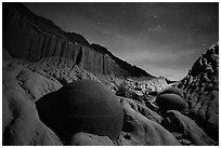 Cannonball and badlands with night starry sky. Theodore Roosevelt National Park, North Dakota, USA. (black and white)