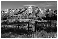 Fence around ranch house site, Elkhorn Ranch Unit. Theodore Roosevelt National Park, North Dakota, USA. (black and white)