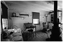 Dining room of Theodore Roosevelt's Maltese Cross Cabin. Theodore Roosevelt National Park, North Dakota, USA. (black and white)