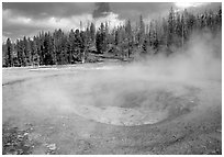 Steam out of Beauty pool in Upper geyser basin. Yellowstone National Park ( black and white)