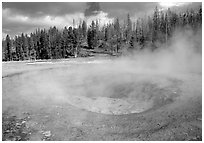 Steam out of Beauty pool in Upper geyser basin. Yellowstone National Park, Wyoming, USA. (black and white)