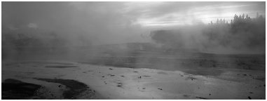 Steam rising in thermal geyser basin a dawn. Yellowstone National Park (Panoramic black and white)