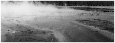 Steam rising from multi-colored thermal springs. Yellowstone National Park (Panoramic black and white)