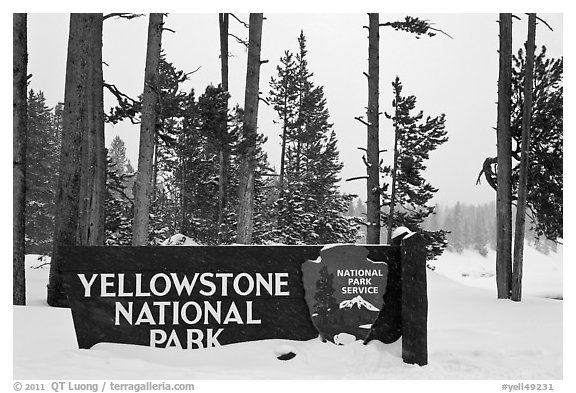 Park entrance sign in winter. Yellowstone National Park, Wyoming, USA.