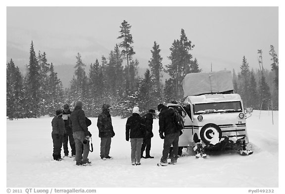 Travelers boarding snow bus. Yellowstone National Park, Wyoming, USA.