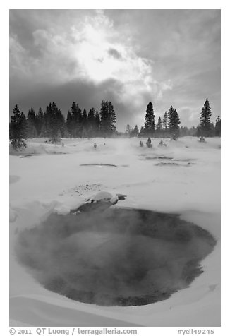Thermal pool and dark clouds, winter. Yellowstone National Park (black and white)