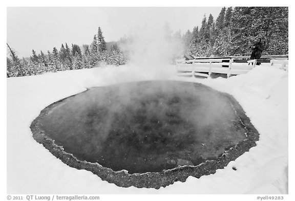 Hiker at Morning Glory Pool, winter. Yellowstone National Park (black and white)