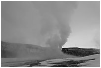 Old Faithful Geyser at dawn. Yellowstone National Park, Wyoming, USA. (black and white)