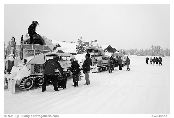 Bombardier snow busses being unloaded at Flagg Ranch. Yellowstone National Park, Wyoming, USA.