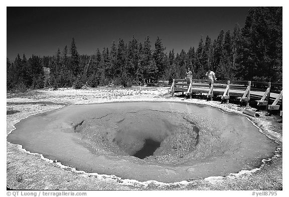 Morning Glory Pool with hikers. Yellowstone National Park, Wyoming, USA.