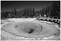 Morning Glory Pool with hikers. Yellowstone National Park, Wyoming, USA. (black and white)
