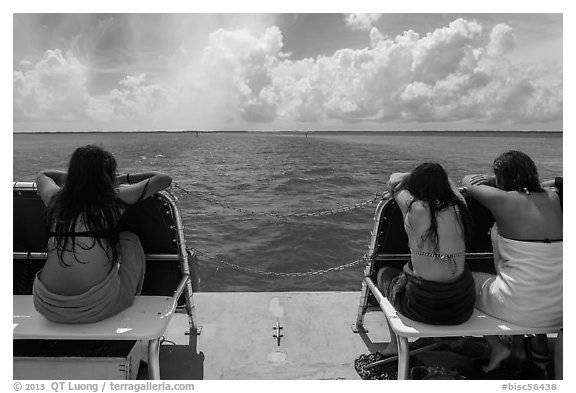 Women sunning themselves on snorkeling boat. Biscayne National Park (black and white)