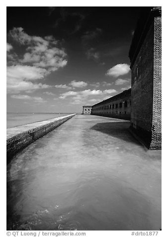 Fort Jefferson moat and massive brick wall on a sunny dayl. Dry Tortugas National Park, Florida, USA.