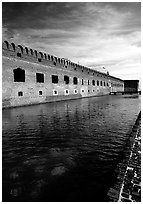 Fort Jefferson moat and thick brick walls. Dry Tortugas National Park, Florida, USA. (black and white)