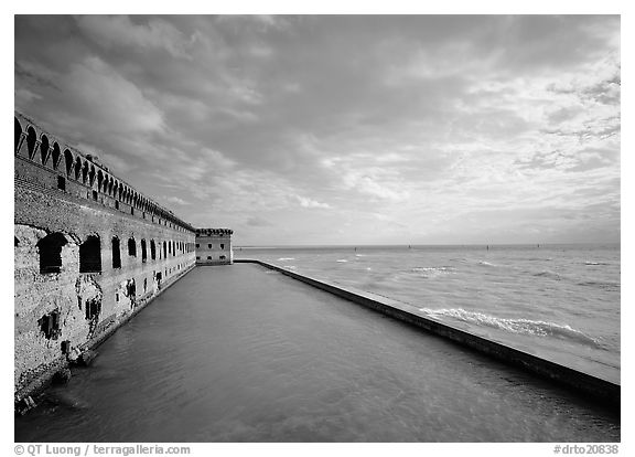 Fort Jefferson wall, moat and seawall, brighter late afternoon light. Dry Tortugas National Park (black and white)