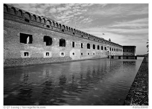 Fort Jefferson moat, walls and lighthouse. Dry Tortugas National Park, Florida, USA.