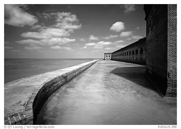 Moat with turquoise waters, seawall, and fort. Dry Tortugas National Park, Florida, USA.