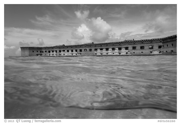 Split view of Fort Jefferson and water with fish. Dry Tortugas National Park, Florida, USA.