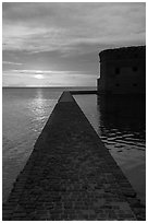 Fort Jefferson seawall and moat at sunset. Dry Tortugas National Park, Florida, USA. (black and white)