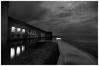 Fort Jefferson, moat, and ocean at night. Dry Tortugas National Park, Florida, USA. (black and white)