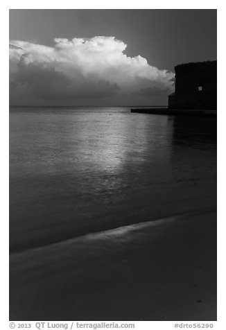 Beach, cloud and fort at sunrise. Dry Tortugas National Park, Florida, USA.