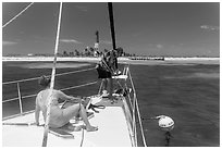 Sailors hooking mooring buoy at Loggerhead Key. Dry Tortugas National Park, Florida, USA. (black and white)