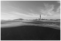 Split view of waters and Loggerhead Light. Dry Tortugas National Park, Florida, USA. (black and white)