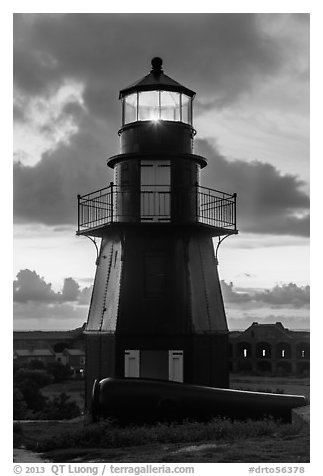 Harbor Light and gun at sunset. Dry Tortugas National Park, Florida, USA.