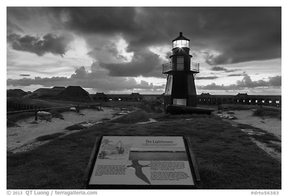 Interpretive sign, Harbor Light, and fort Jefferson. Dry Tortugas National Park, Florida, USA.