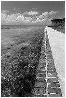 Seawall and coral reefs. Dry Tortugas National Park, Florida, USA. (black and white)