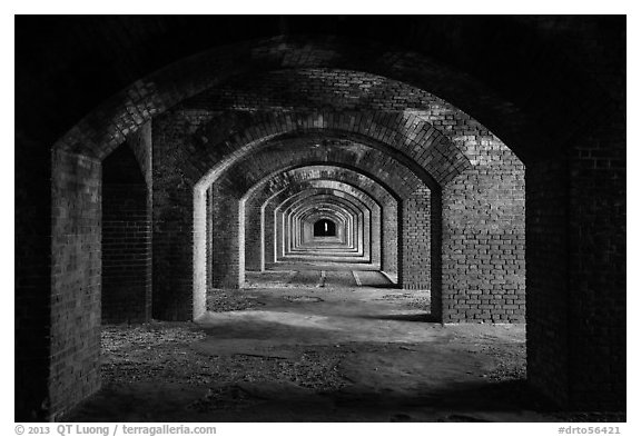 Gallery illuminated by last light inside Fort Jefferson. Dry Tortugas National Park (black and white)
