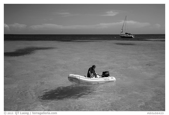 Dinghy and sailbaot in transparent waters, Loggerhead Key. Dry Tortugas National Park, Florida, USA.