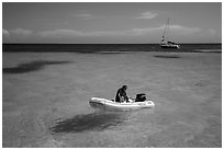 Dinghy and sailbaot in transparent waters, Loggerhead Key. Dry Tortugas National Park, Florida, USA. (black and white)