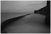 Seawall at dusk during  storm. Dry Tortugas National Park, Florida, USA. (black and white)